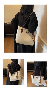 Canvas tote bag with brown faux leather trim and retro wooden bead tassel decoration