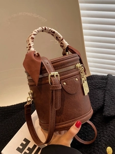 Retro brown cylinder bucket bag with leopard print silk scarf handle and gold hardware
