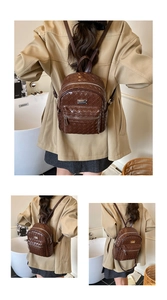 Détail d'un sac à dos en cuir tressé marron foncé avec fermetures éclair argentées