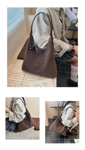 Détail d'un grand sac hobo marron foncé en cuir vintage souple avec bandoulière