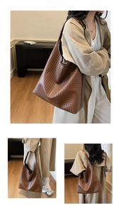 Close-up of deep brown woven leather texture and spacious hobo bag design for women