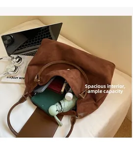 Brown suede tote bag interior showing large capacity for laptop, tablet and daily items