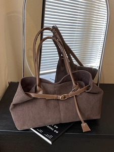 Brown corduroy shoulder bag with large capacity and stylish leather strap accents