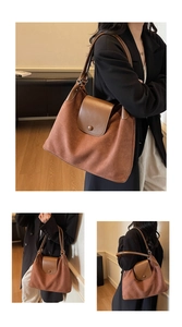 Detail of brown suede patchwork hobo bag featuring leather flap and metal snap closure