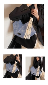 Detail of light blue corduroy tote bag with black piping and Chia'2nd logo ribbon strap