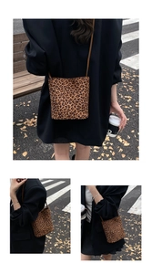 Detailed view of trendy leopard print bucket bag with high-quality faux leather texture