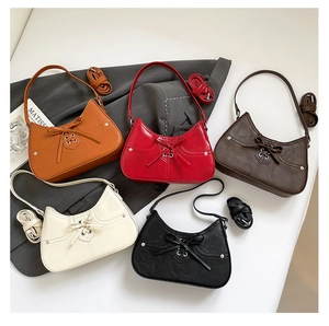 Detail view of colorful shoulder bags featuring unique bow drawstring and matte PU texture
