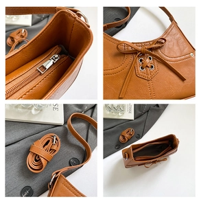 Detail of caramel leather handbag featuring decorative bow ties and internal zipper pocket