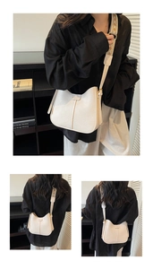 Close-up of litchi textured cream bucket bag with geometric jacquard wide strap