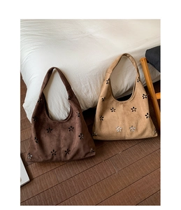 Detailed laser-cut flower pattern on vintage matte suede tote bag for daily use