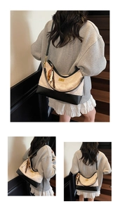 Close-up of quilted contrast shoulder bag featuring wooden beads and tassel detail