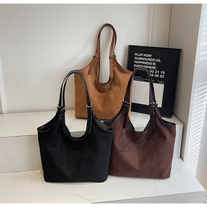 Detailed trio of vintage matte tote bags in black, caramel, and coffee brown suede
