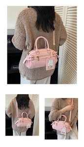 Pink Boston underarm bag with adjustable straps and shoulder strap in high-quality texture