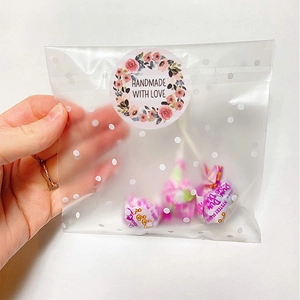 Translucent polka dot gift bag with Handmade with Love seal and floral thank you sticker