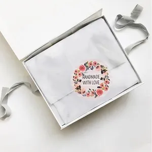 500pcs floral handmade with love round stickers on a white gift box with gray ribbon
