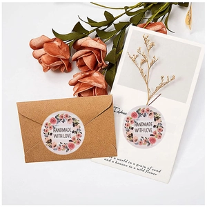 Detail of pink floral handmade with love stickers on envelopes with dried flowers