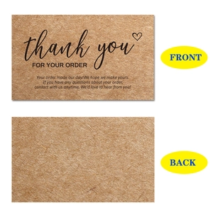 Front and back view of kraft paper thank you business cards with black handwritten text