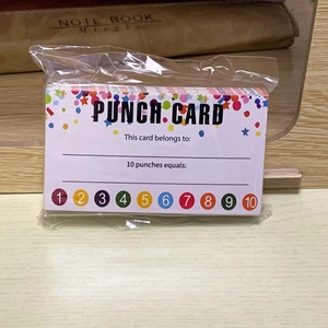 Macro view of loyalty punch cards for business or classroom reward tracking on wood surface