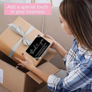 Black Thank You stickers with elegant script for business packaging and gift boxes