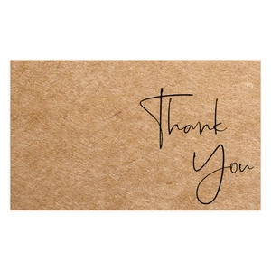 Close-up of minimalist kraft paper Thank You card with elegant black script lettering