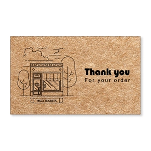 Macro shot of Kraft paper thank you cards with small business illustrations for packaging
