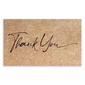 Close-up of rectangular kraft paper thank you card with black script and fiber texture
