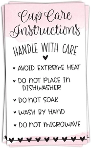 Detailed view of glass cup care instruction card with pink watercolor design