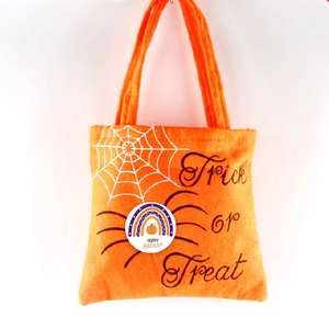 Orange felt Halloween trick or treat candy bag with spider web and pumpkin graphics