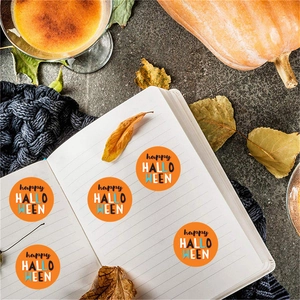 Roll of orange Happy Halloween round stickers for festival decoration and gift sealing