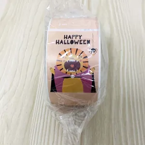 Detail of Happy Halloween sticker roll featuring cartoon lion and spider motifs