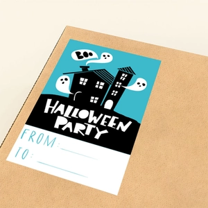 Detail of Halloween party sticker with ghost and house silhouettes on gift box