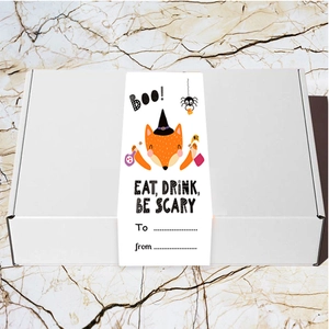 Detail of Halloween gift box with fox graphic sleeve and Eat Drink Be Scary slogan