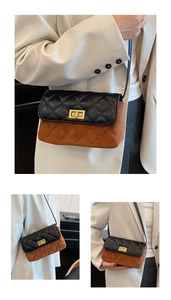 Detail of rhombic quilted crossbody bag with golden twist lock and mixed leather textures