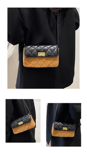 Detail showing two-tone suede crossbody bag with diamond quilting and gold metal lock