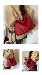 Detailed views of a red leather hobo bag showing the large capacity and soft slouchy texture