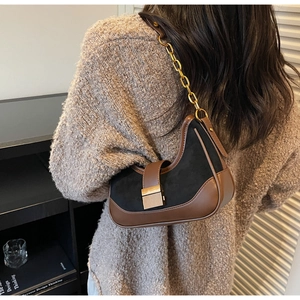 Detail of the vintage hobo bag showing faux suede texture and gold chain strap detail