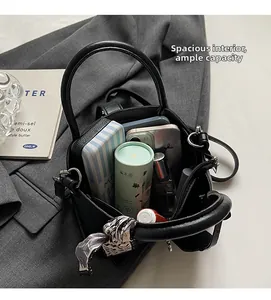 Top view of spacious black pebble leather bucket bag showing large interior capacity