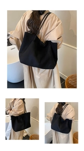 Detailed views of a black large capacity tote bag made of matte canvas for daily commuting