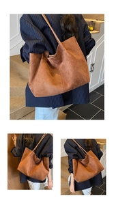 Close-up of caramel suede tote bag texture and long shoulder strap for daily commuting