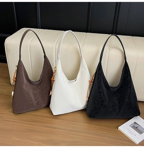 Elegant hobo tote bags in brown, beige, and black with wooden bead tassels