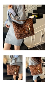 Detail of vintage leopard print tote bag with beaded charm and brown shoulder straps