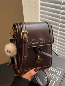 Vintage dark brown oil wax leather crossbody bag with cute plush pendant and gold hardware