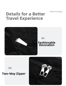 Detail of silver dual-way metal zippers and buckle on black textured leather backpack