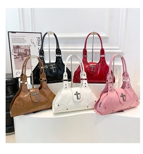 Group display of five vintage faux leather shoulder bags in various colors on a white pedestal