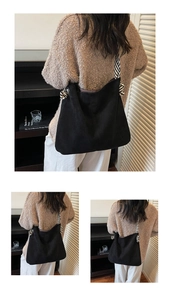 Detail of a black matte tote bag featuring distinctive black and white corded strap knots