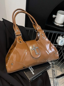 Vintage brown glossy leather baguette bag with silver cross charm and metal chain decoration