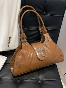 Brown vintage faux leather shoulder bag with metallic cross details and silver rivets