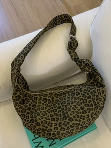 Retro leopard print canvas hobo bag with adjustable strap and silver metal buckle
