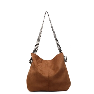 Retro caramel suede hobo bag with a stylish black and white striped woven strap