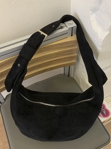 Large black suede crescent bag with adjustable wide strap for daily commute and leisure